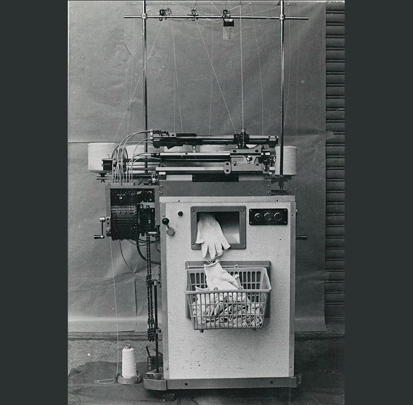 Development of the world's first fully automated glove knitting machine